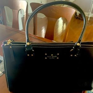 Beautiful roomie three compartment Kate Spade satchel purse. Slightly used.